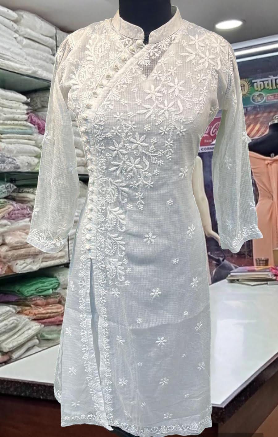 White Kota Doria kurta with heavy chikankari work and stand collar - front view