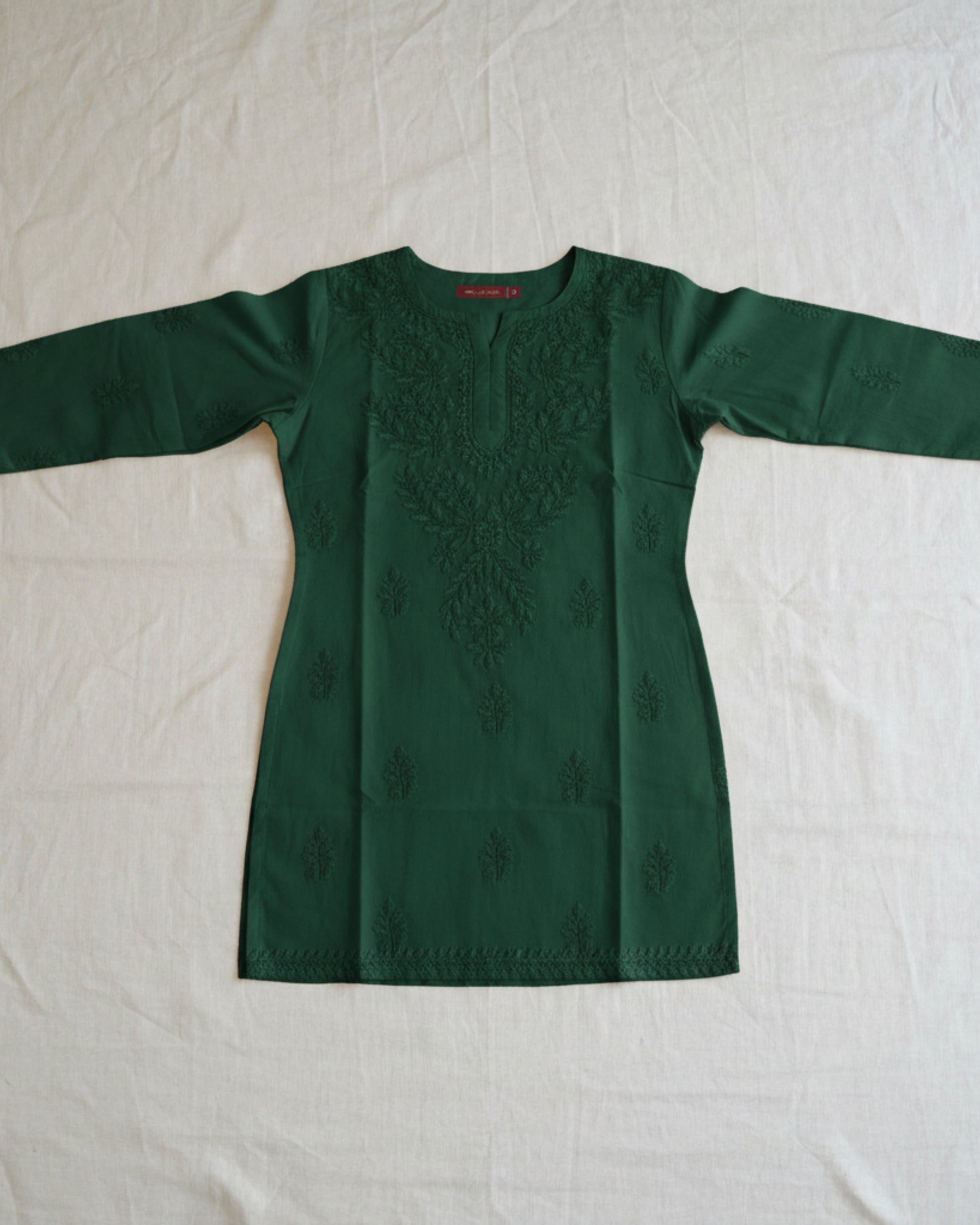 Bottle green cotton short top with heavy chikankari work - flat lay front view