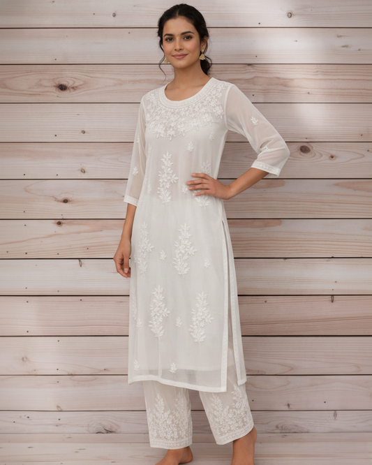 White georgette kurta palazzo set with heavy chikankari embroidery - front view
